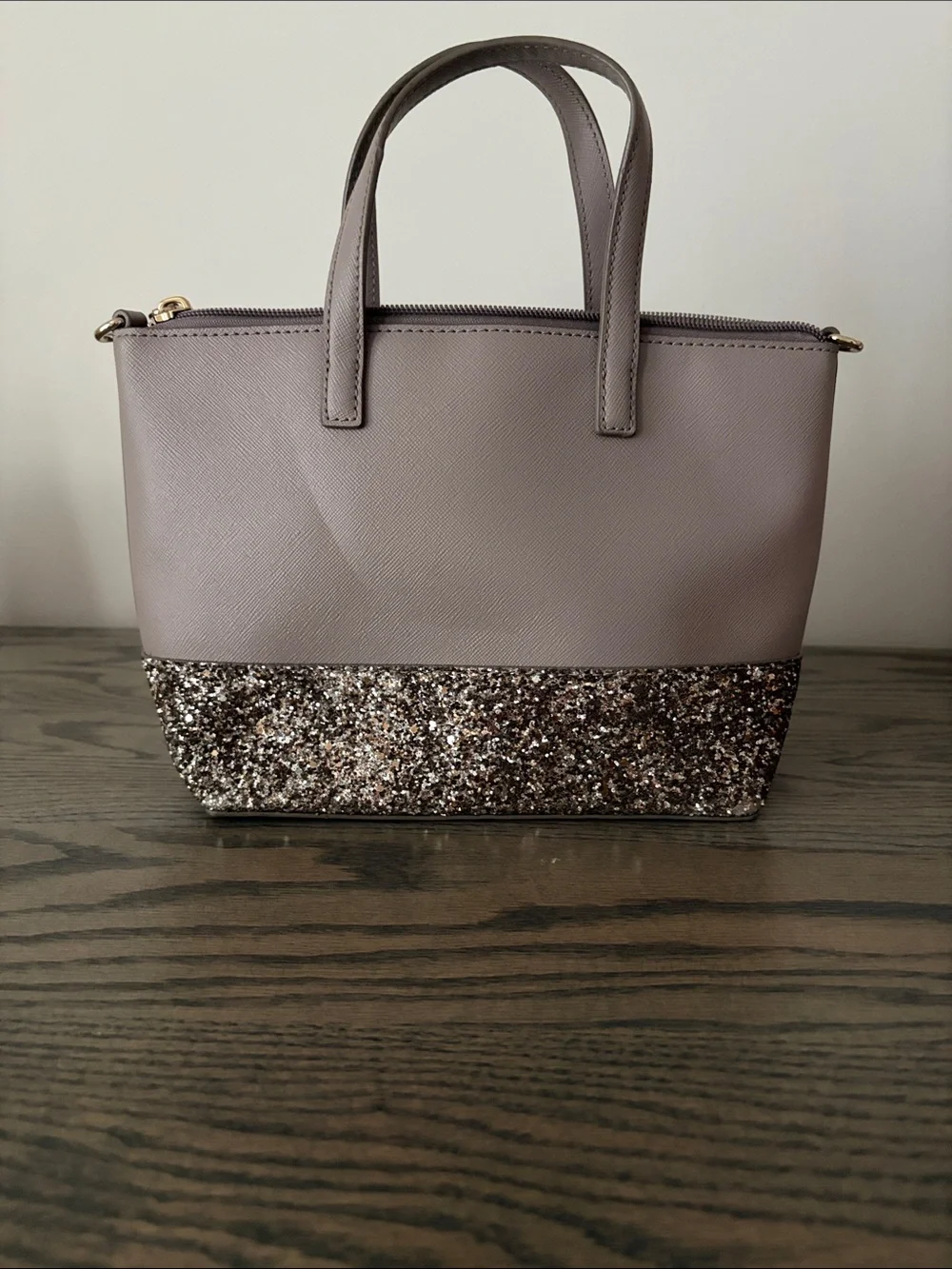 kate spade mauve tote with glitter bottom and gold logo